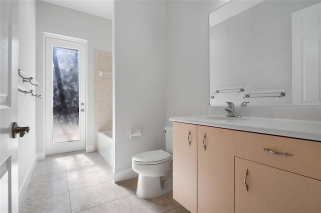 full bathroom with baseboards, vanity, toilet, and tile patterned floors