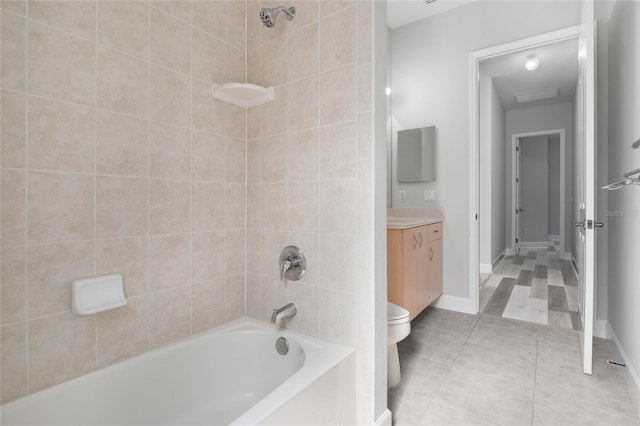 full bathroom featuring toilet, vanity, and tiled shower / bath combo