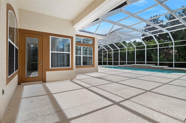 outdoor pool with a lanai and a patio