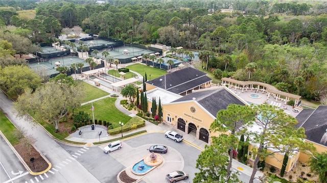 birds eye view of property featuring a wooded view