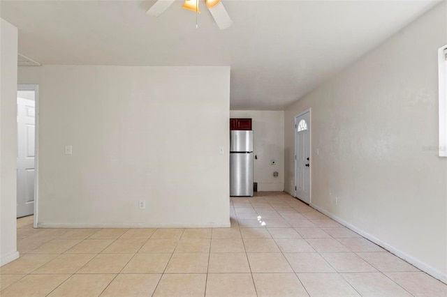 tiled empty room with ceiling fan