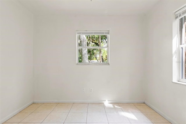 spare room featuring light tile patterned floors