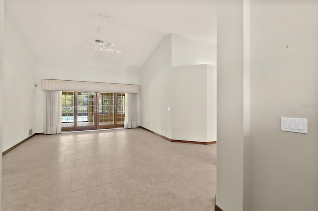 empty room featuring ceiling fan and high vaulted ceiling