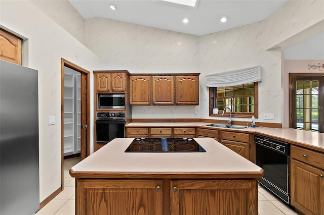 kitchen featuring light tile patterned flooring, a center island, sink, and black appliances