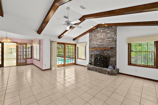 unfurnished living room featuring light tile patterned flooring, ceiling fan, a brick fireplace, and vaulted ceiling with beams