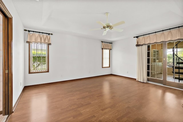 unfurnished room featuring hardwood / wood-style flooring and ceiling fan