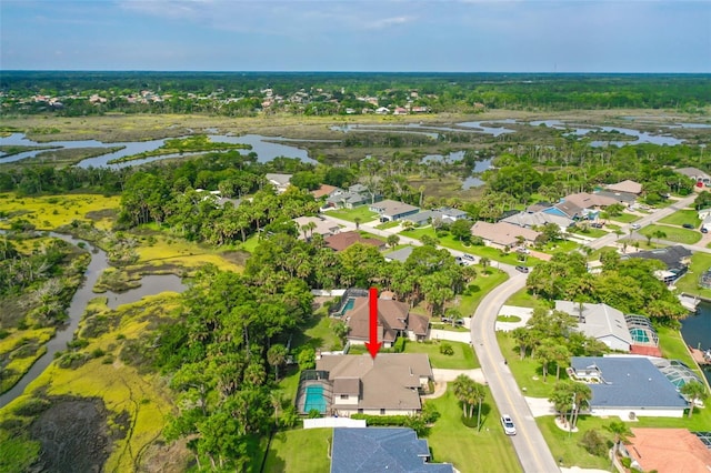 bird's eye view with a water view