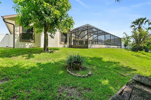 view of yard featuring glass enclosure