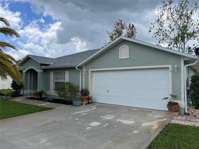 single story home with a garage