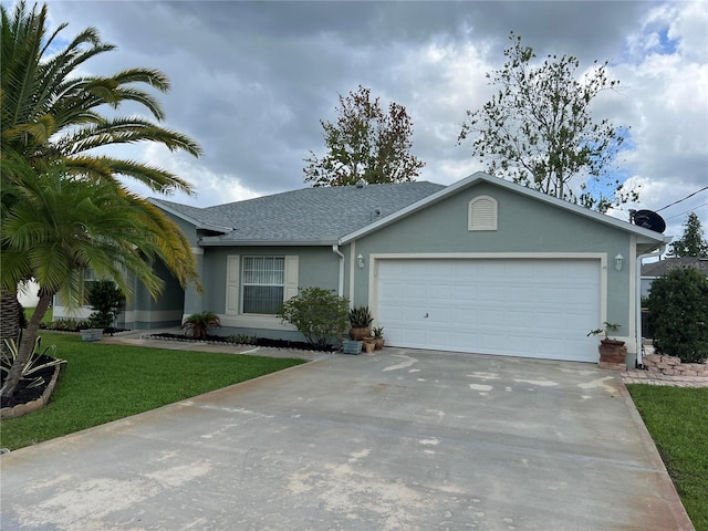 ranch-style home featuring a garage and a front lawn