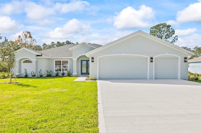 ranch-style house featuring a front yard and a garage