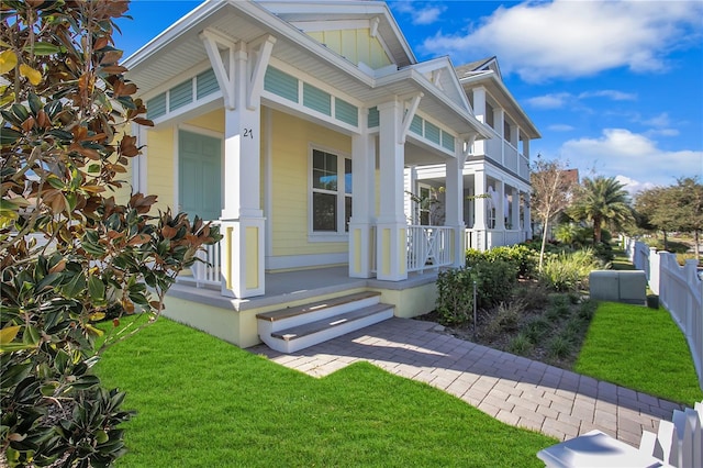 exterior space featuring a front lawn and a porch