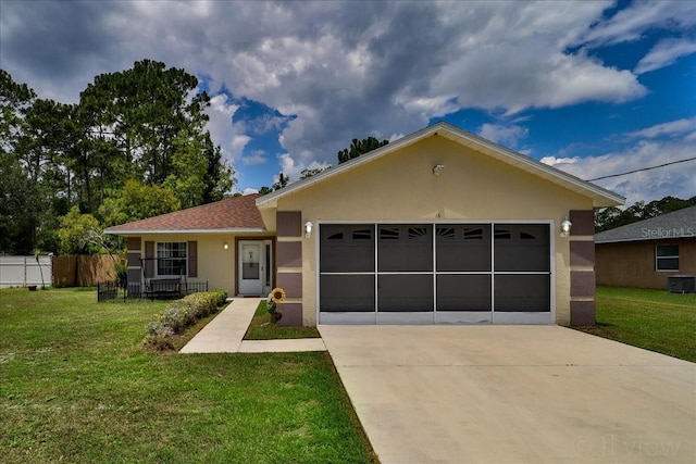 view of front of house featuring covered porch, a front yard, and a garage