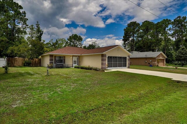 ranch-style house with a garage and a front lawn