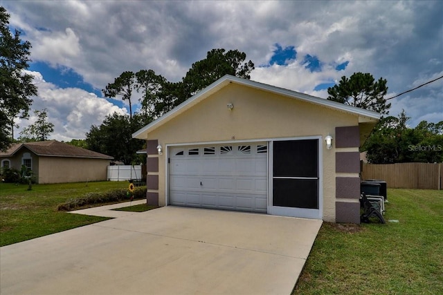 garage featuring a lawn