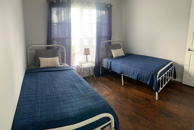 bedroom featuring dark wood-type flooring