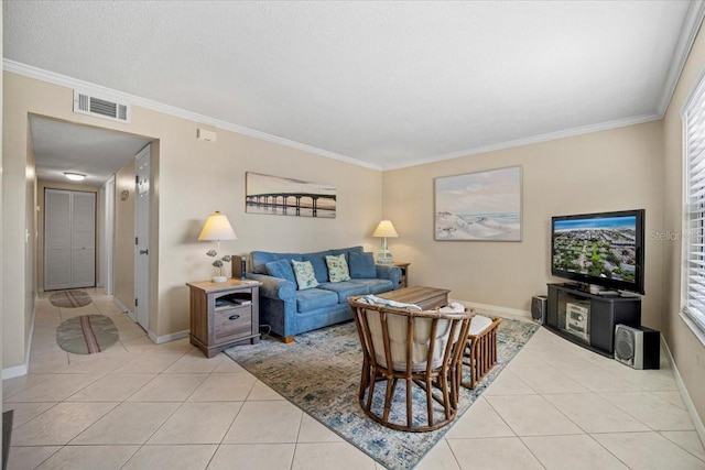 tiled living room with a textured ceiling and crown molding