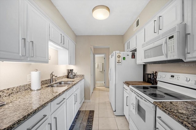 kitchen with white cabinetry, sink, and white appliances