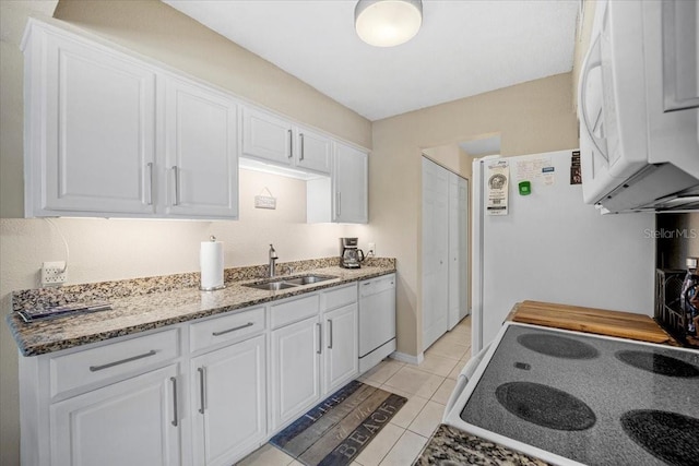 kitchen featuring white cabinetry, sink, and white appliances