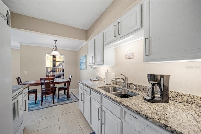 kitchen featuring pendant lighting, white cabinetry, sink, and light tile patterned floors