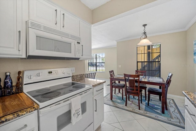 kitchen featuring white cabinets, white appliances, ornamental molding, and dark stone countertops