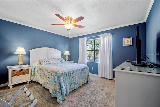 carpeted bedroom with a textured ceiling, ceiling fan, and crown molding