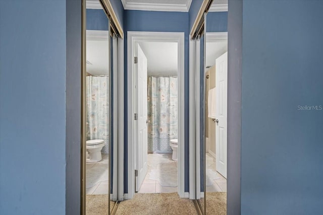 hall with light carpet and crown molding