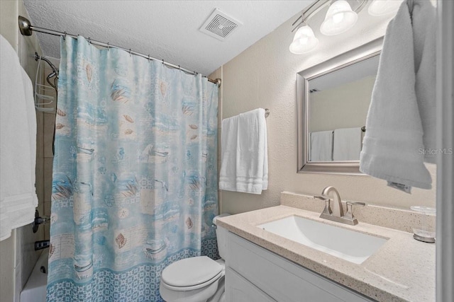 full bathroom featuring shower / tub combo, vanity, a textured ceiling, and toilet