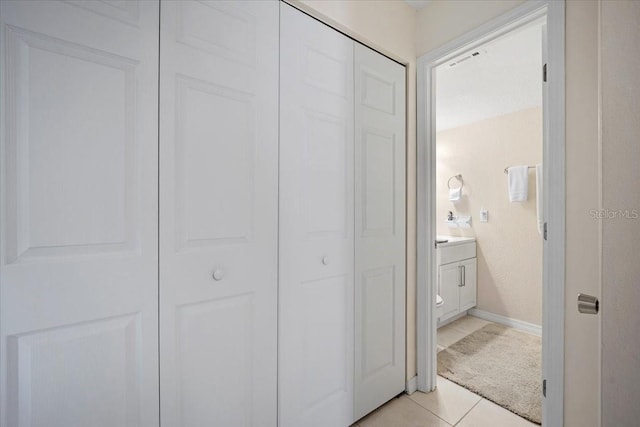 interior space featuring tile patterned flooring and vanity