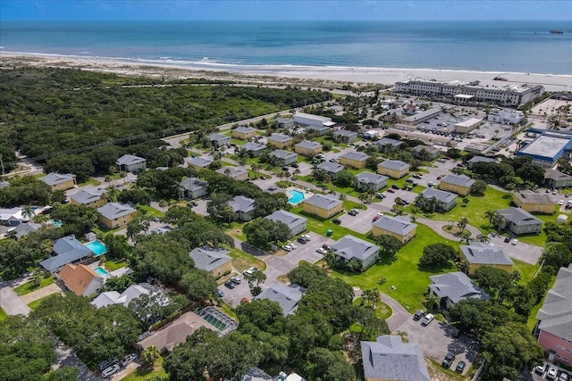 aerial view featuring a water view and a view of the beach