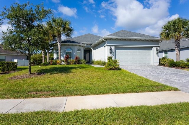 view of front of house with a garage and a front yard