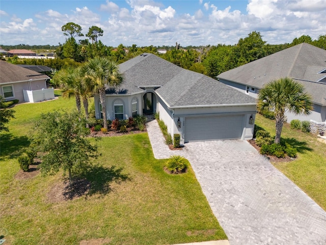 single story home with a garage and a front yard