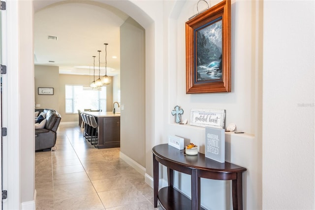 hallway with light tile patterned flooring