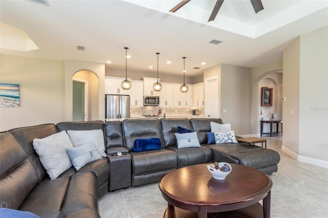 living room with ceiling fan