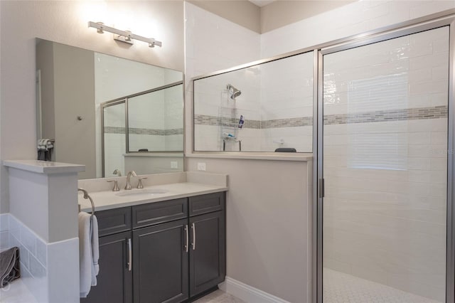 bathroom with vanity and a shower with shower door