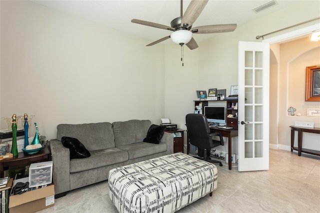 tiled office featuring ceiling fan and french doors