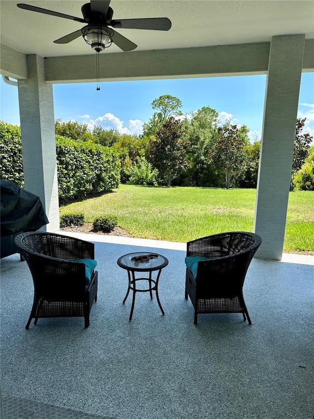 view of patio with ceiling fan and grilling area