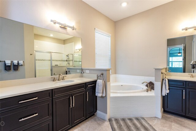 bathroom with vanity, separate shower and tub, and plenty of natural light