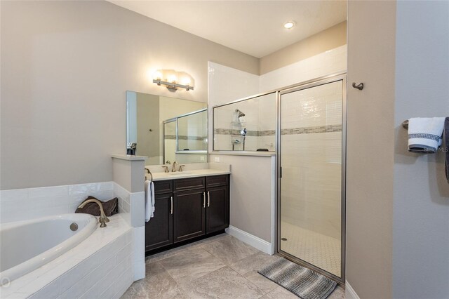 bathroom featuring tile patterned flooring, vanity, and independent shower and bath