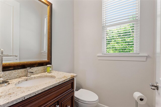 12245 Park Ave, Windermere, FL 34786 - half bathroom with toilet and vanity