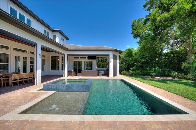 12245 Park Ave, Windermere, FL 34786 - outdoor pool with a patio, an in-ground hot tub, and an outdoor living space