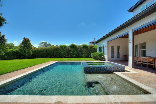 12245 Park Ave, Windermere, FL 34786 - view of pool featuring french doors, a yard, a patio area, and a pool with connected hot tub