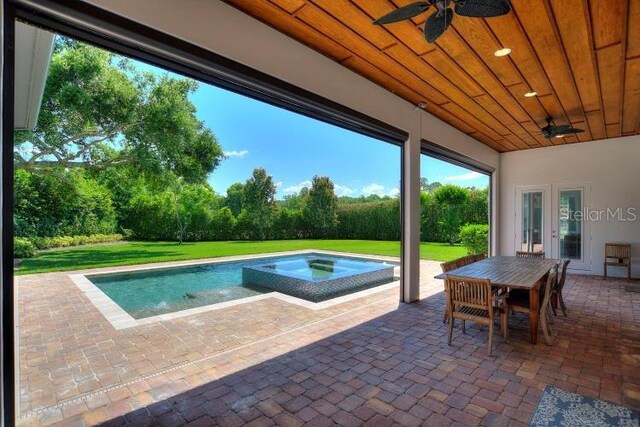 12245 Park Ave, Windermere, FL 34786 - view of pool featuring a ceiling fan, a patio, an in-ground hot tub, and french doors