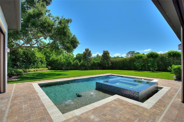 12245 Park Ave, Windermere, FL 34786 - view of swimming pool featuring a yard, an in-ground hot tub, and a patio
