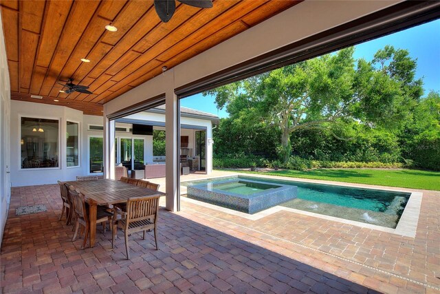 12245 Park Ave, Windermere, FL 34786 - outdoor pool with a ceiling fan, an in-ground hot tub, a patio area, and outdoor dining space