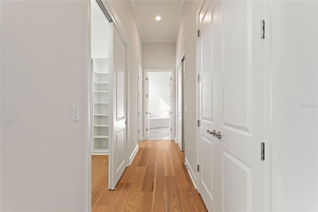 12245 Park Ave, Windermere, FL 34786 - corridor with light wood-type flooring, crown molding, baseboards, and recessed lighting