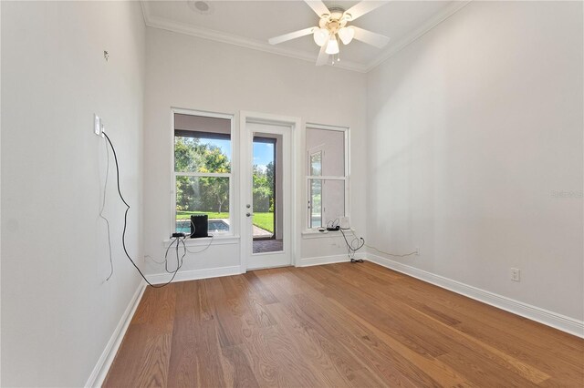 12245 Park Ave, Windermere, FL 34786 - entryway with wood finished floors, crown molding, baseboards, and a ceiling fan