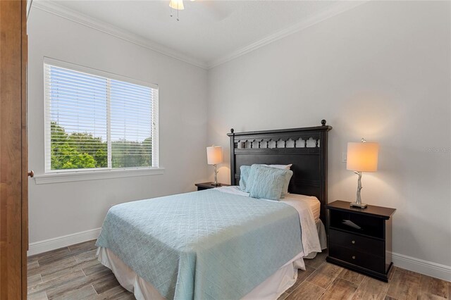 12245 Park Ave, Windermere, FL 34786 - bedroom featuring baseboards, ornamental molding, wood finished floors, and a ceiling fan