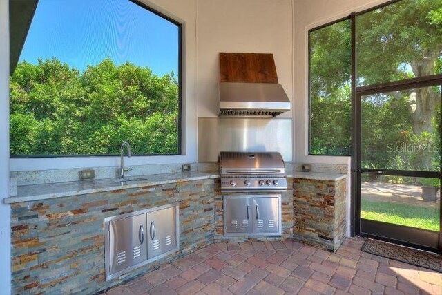 12245 Park Ave, Windermere, FL 34786 - unfurnished sunroom featuring a sink