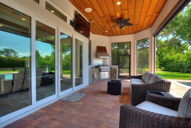12245 Park Ave, Windermere, FL 34786 - sunroom with area for grilling, ceiling fan, and plenty of natural light
